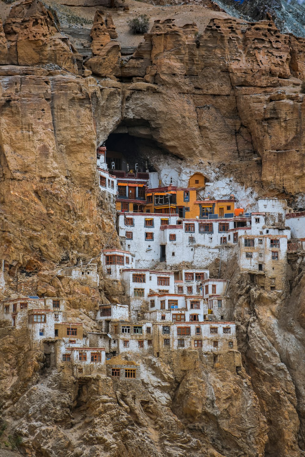 a group of buildings built into the side of a mountain