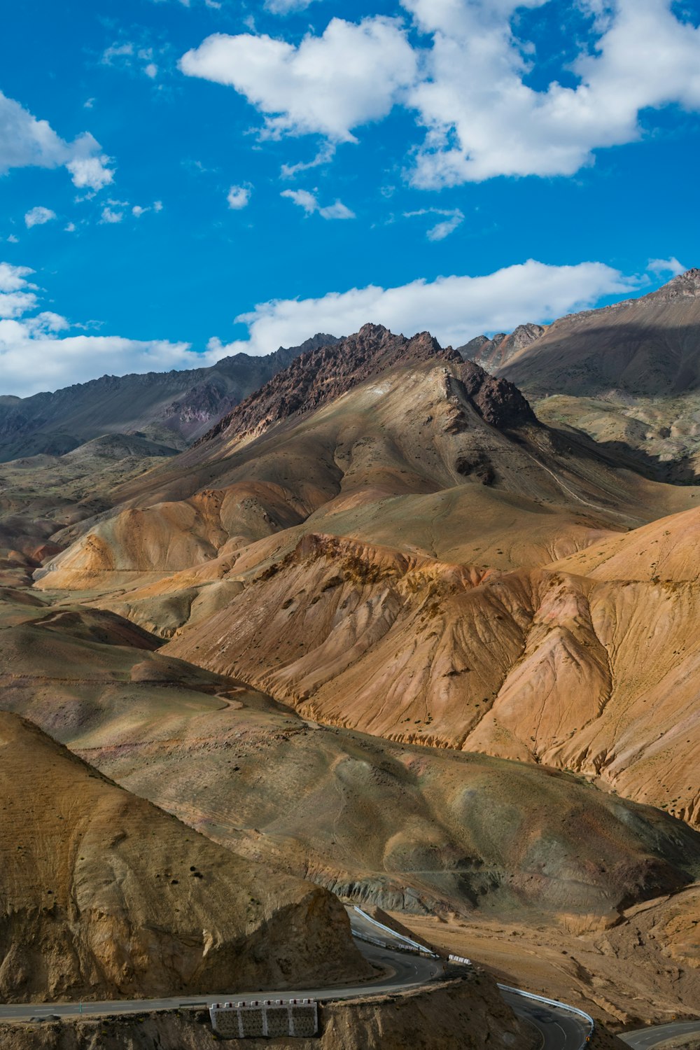 a scenic view of mountains and a road