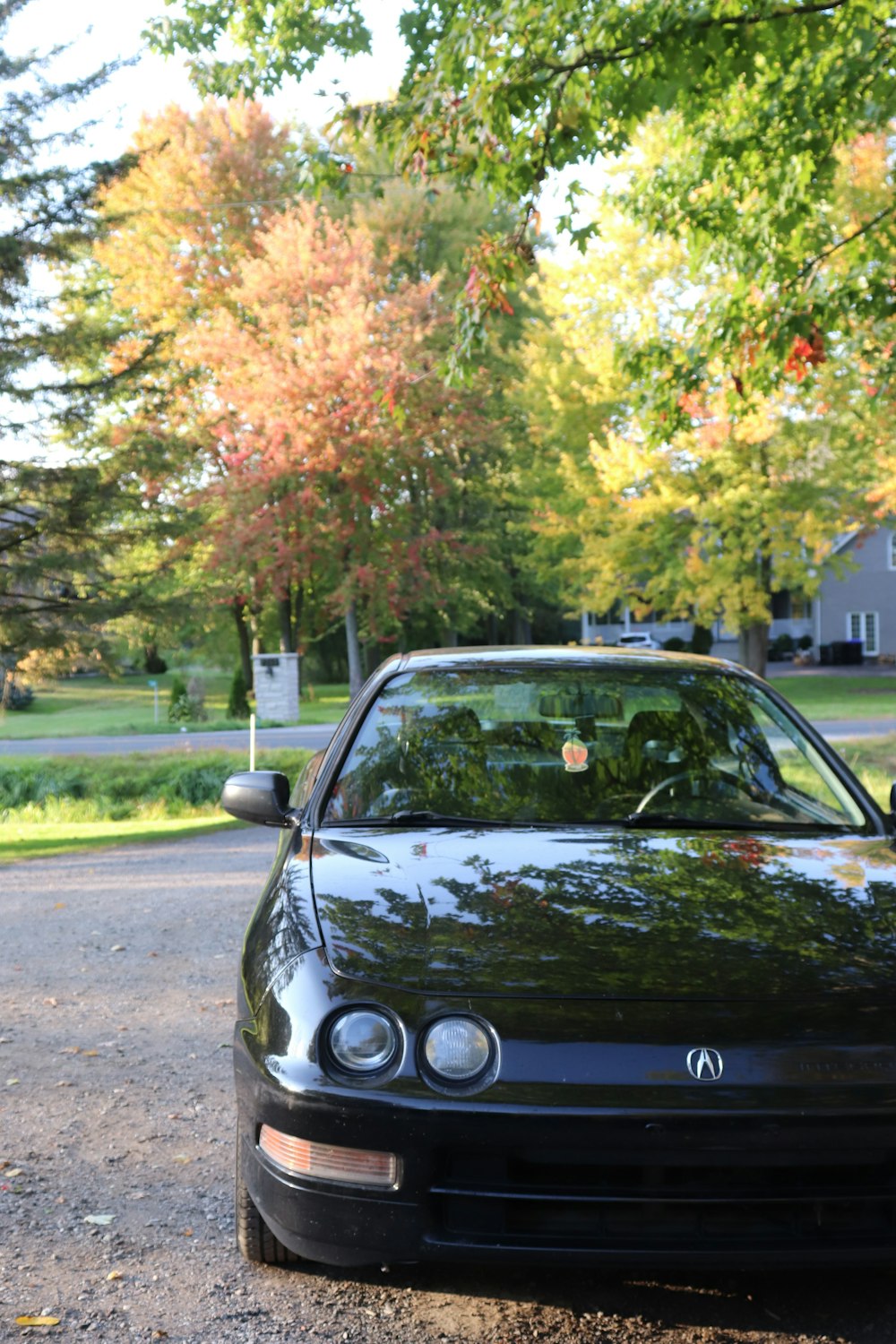 a black sports car parked on the side of the road