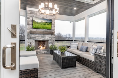a living room with a couch a table and a fire place