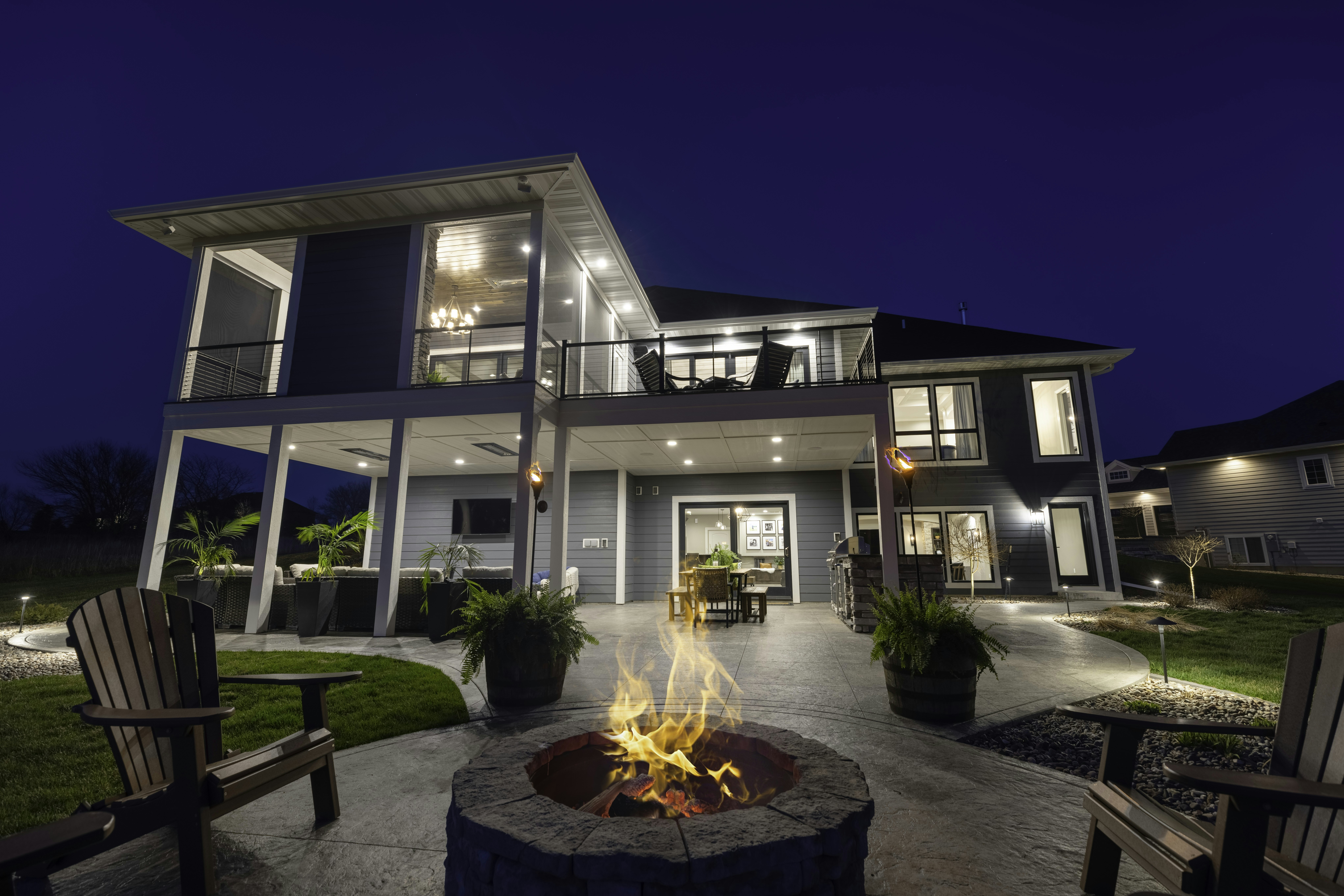 a house with a fire pit in front of it