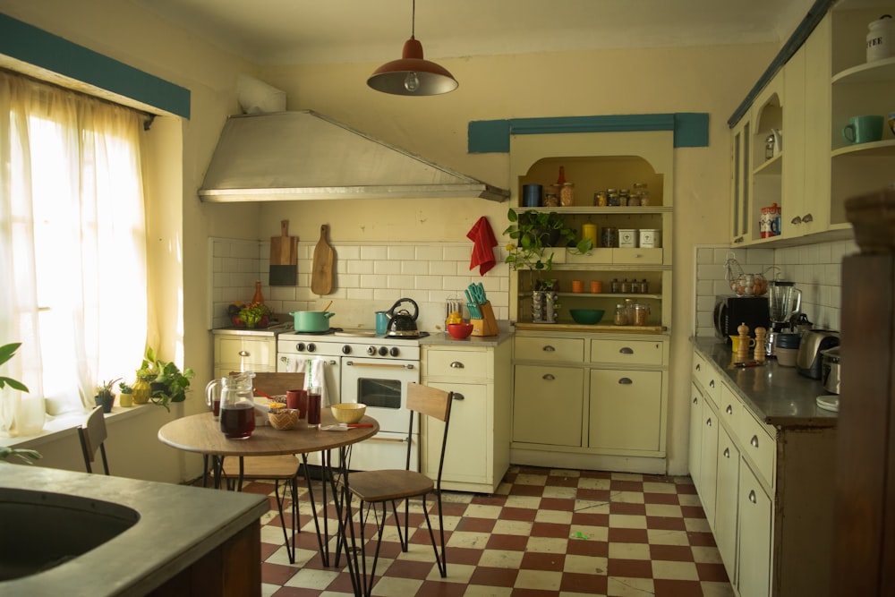 a kitchen with a checkered floor and a stove top oven