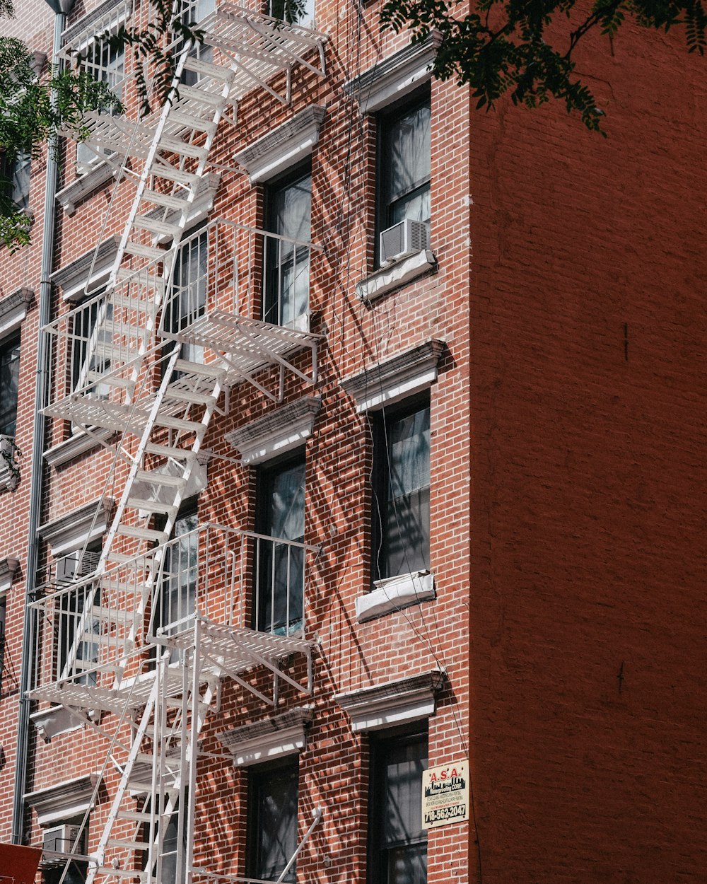 a fire escape on the side of a brick building