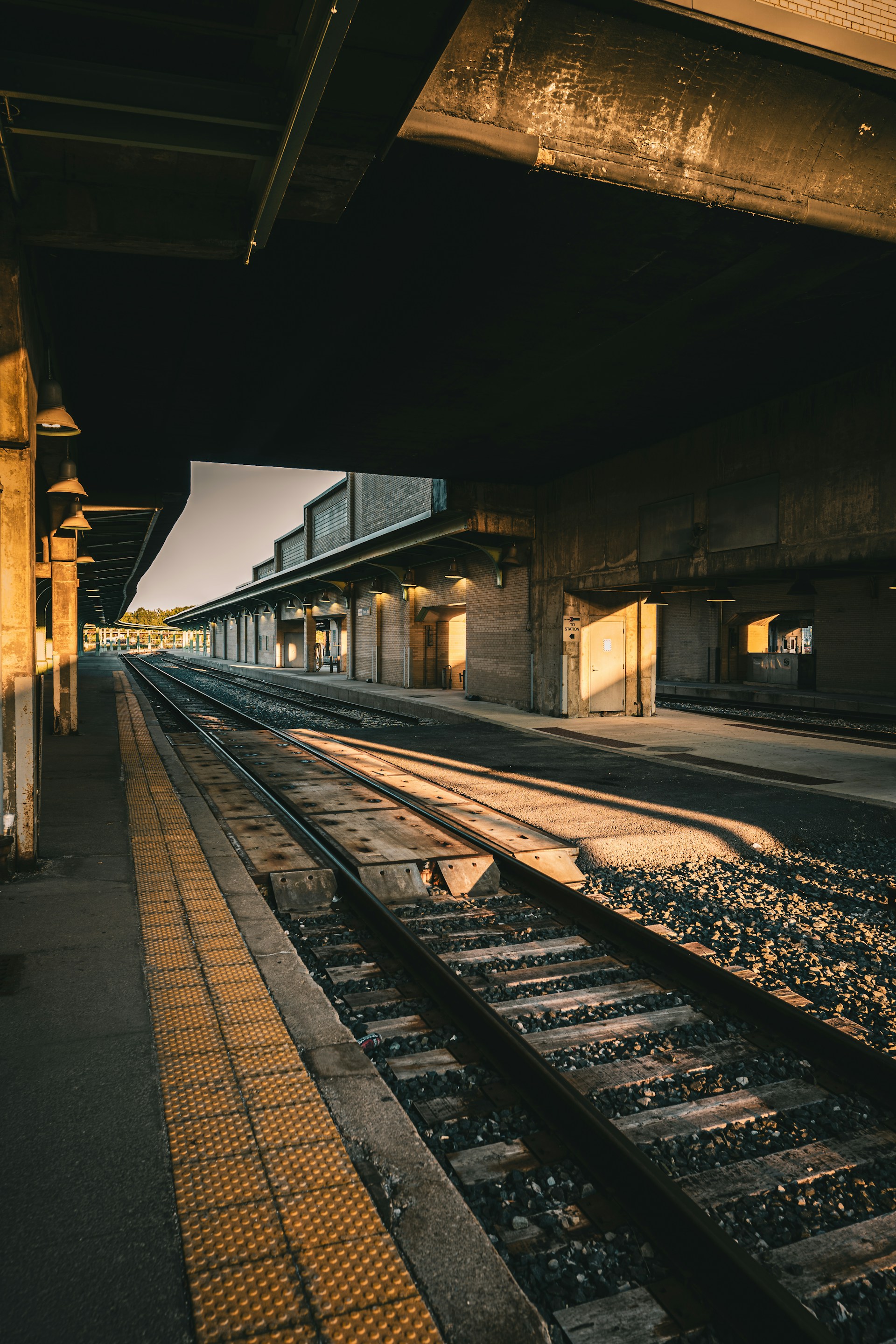 a train station with a train on the tracks
