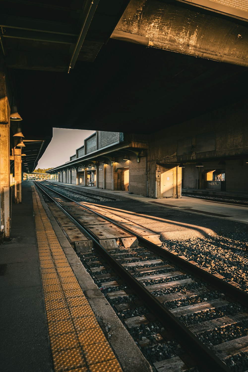 a train station with a train on the tracks