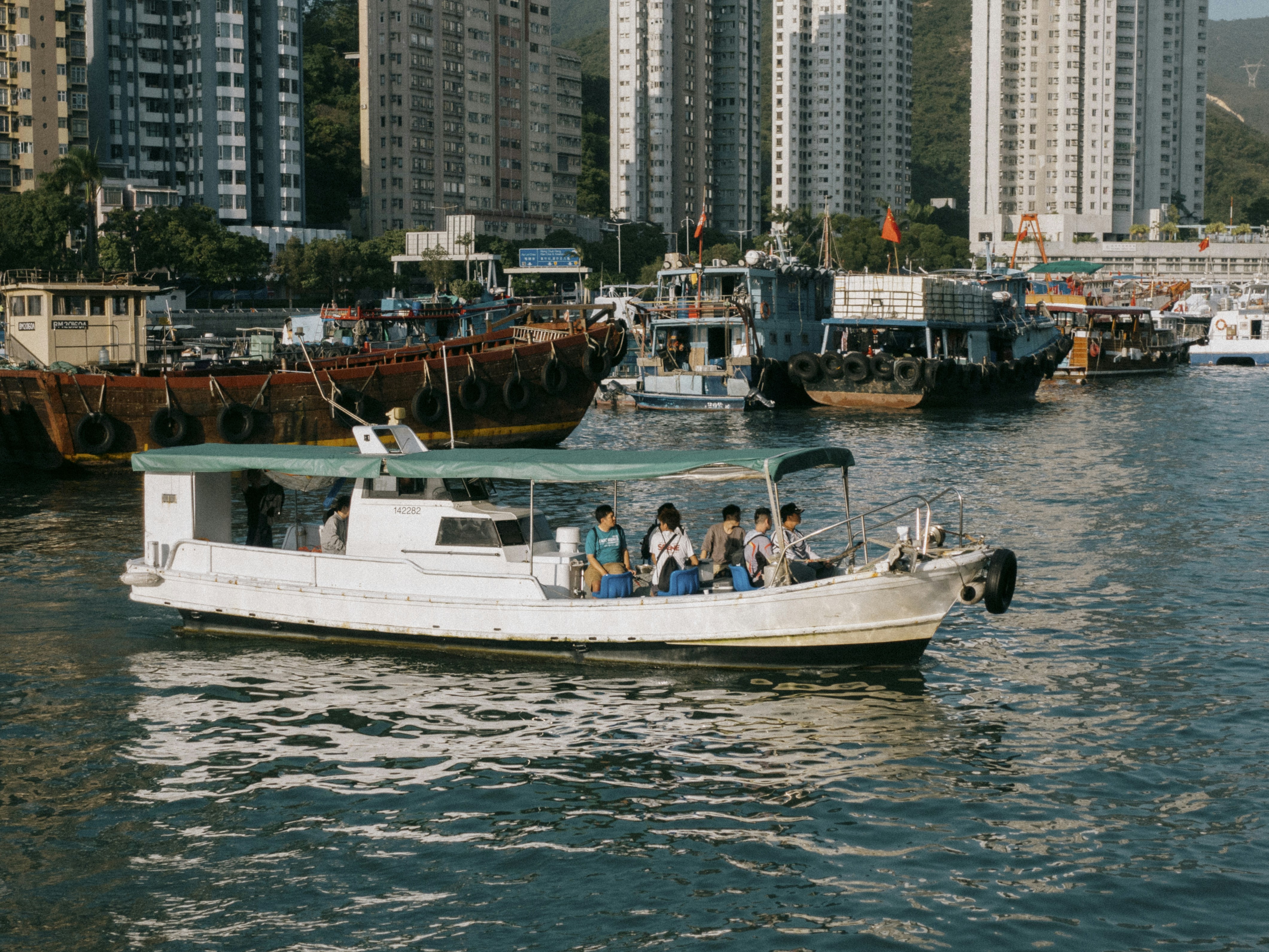 a group of people riding on the back of a boat