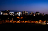 A sweeping Trondheim cityscape at dusk with glowing streetlights.