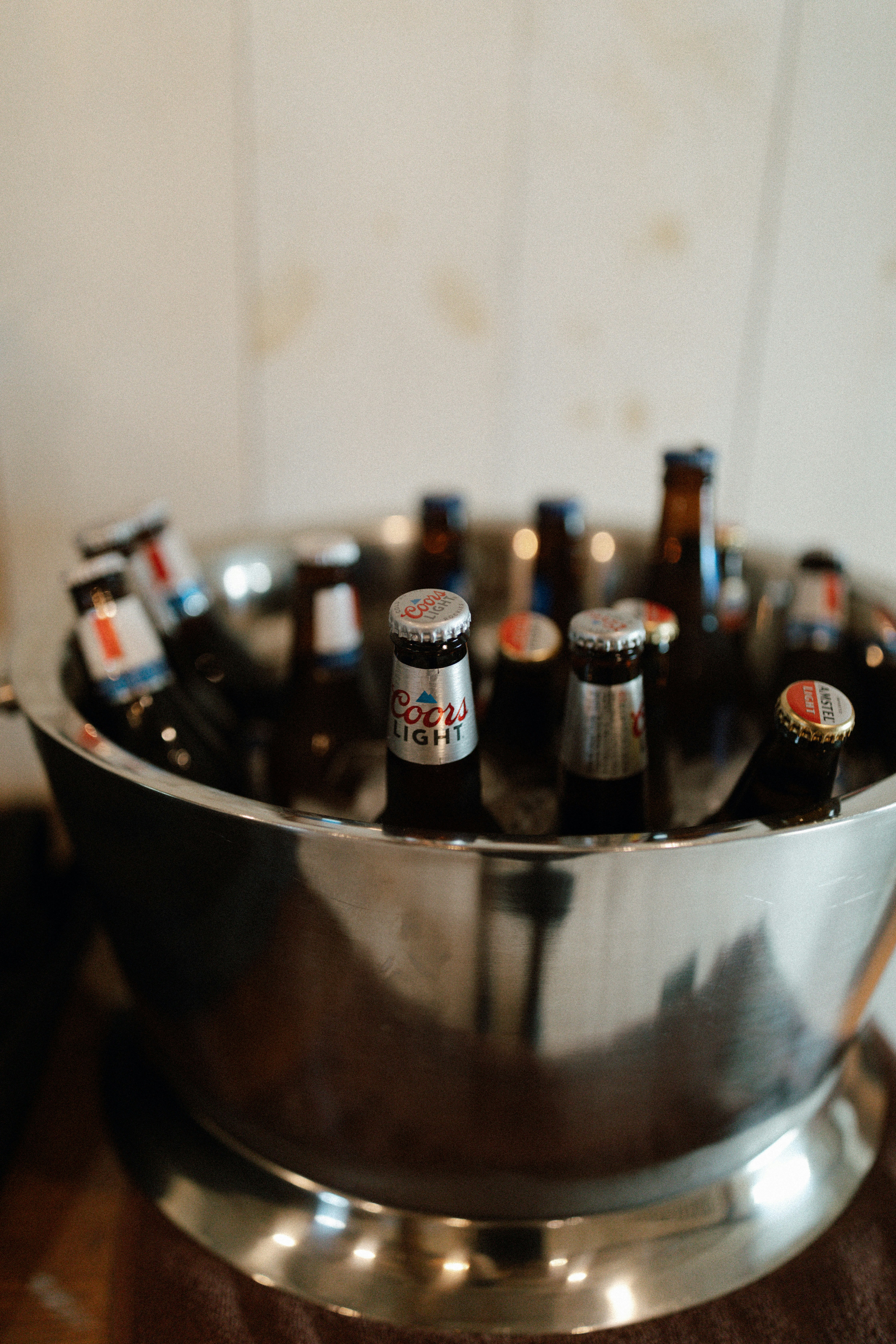 A metal bowl filled with bottles of beer photo Free Beer Image on