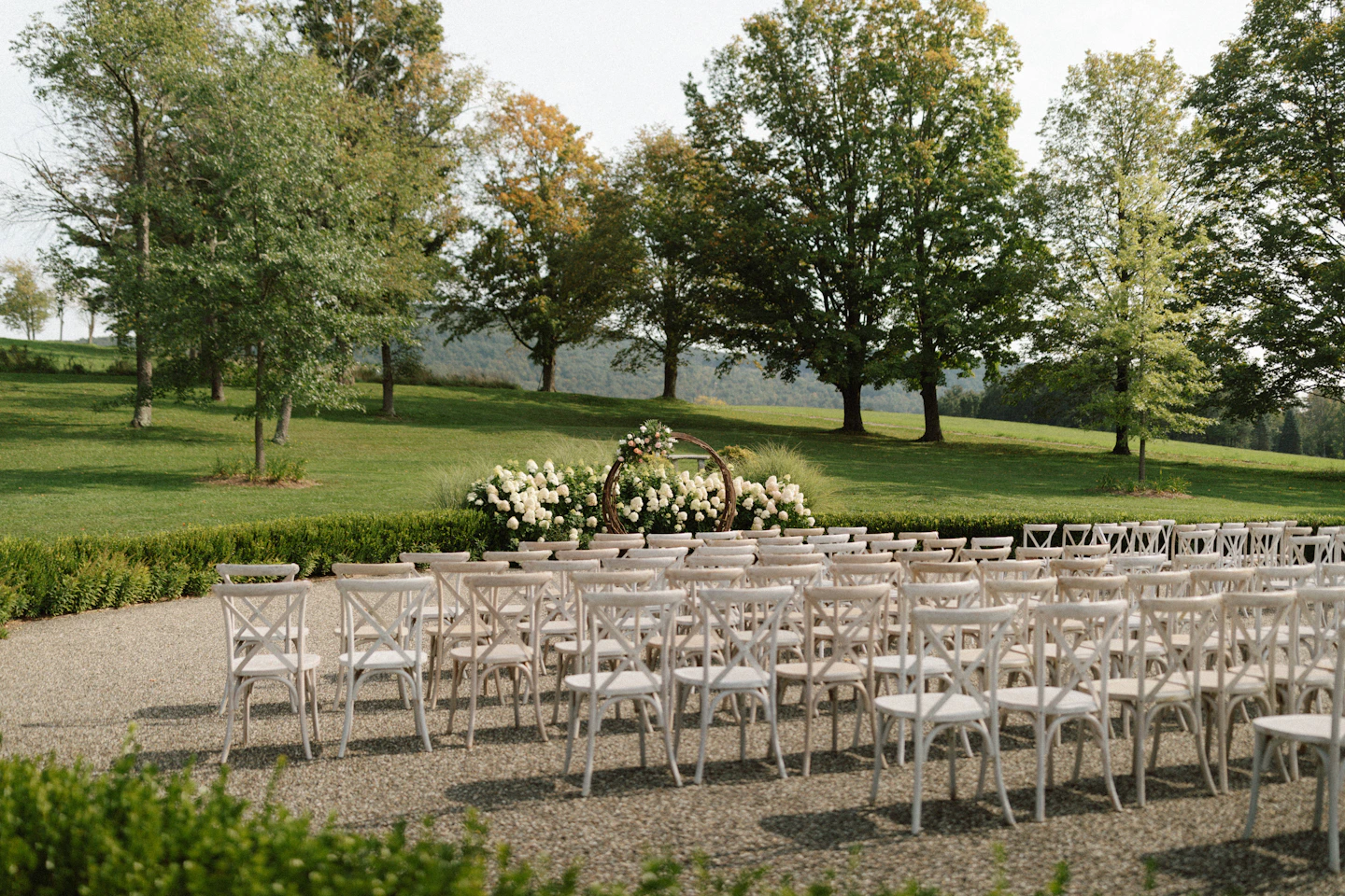 Rows of chairs prepared for an outdoor wedding ceremony