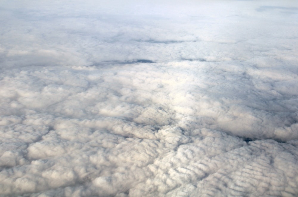 a view of clouds from an airplane window