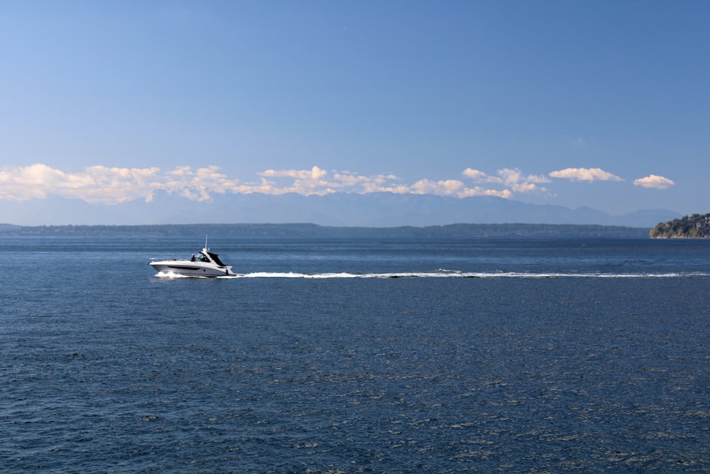 a motorboat speeding across a large body of water