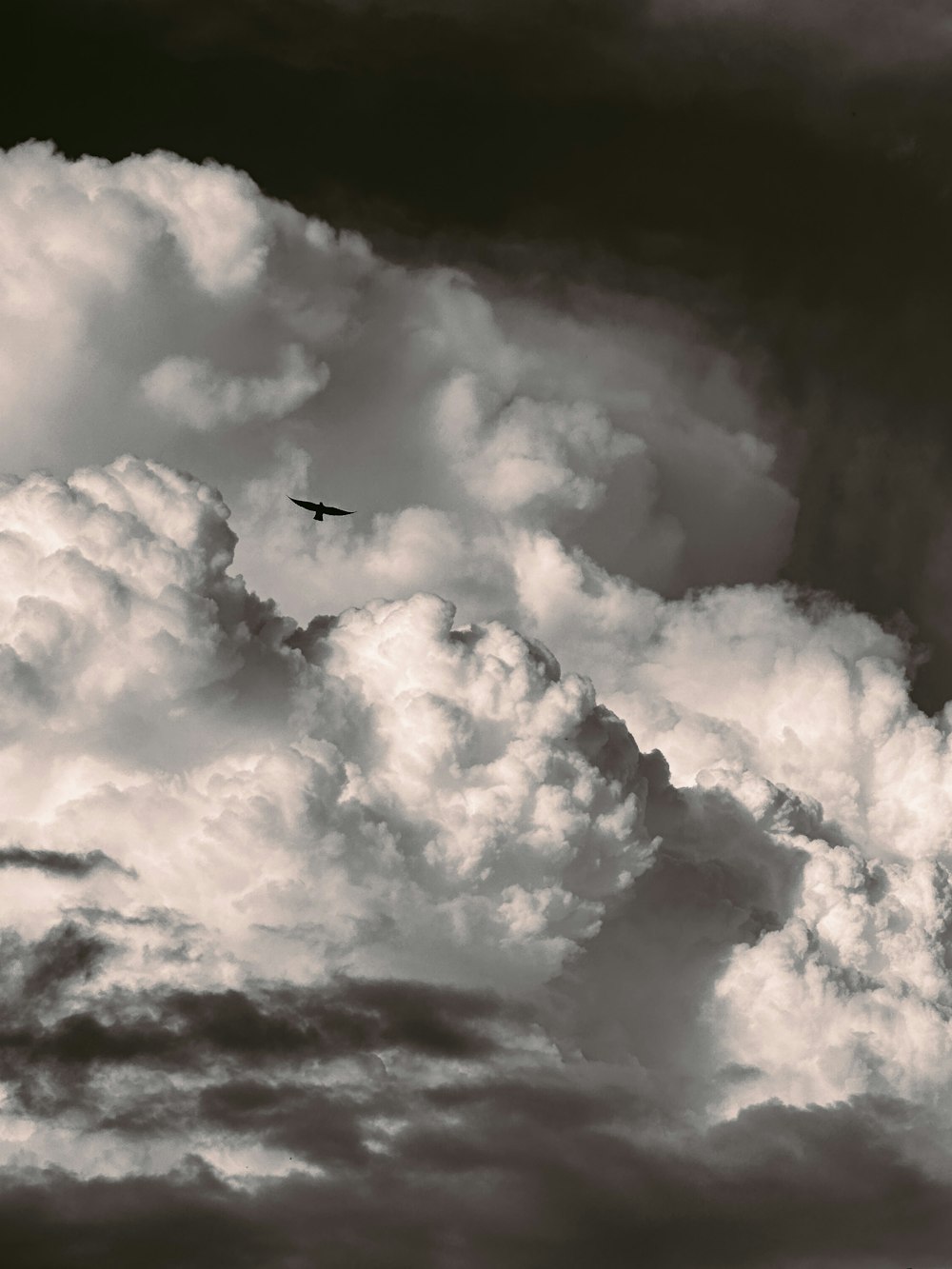 a plane is flying through a cloudy sky