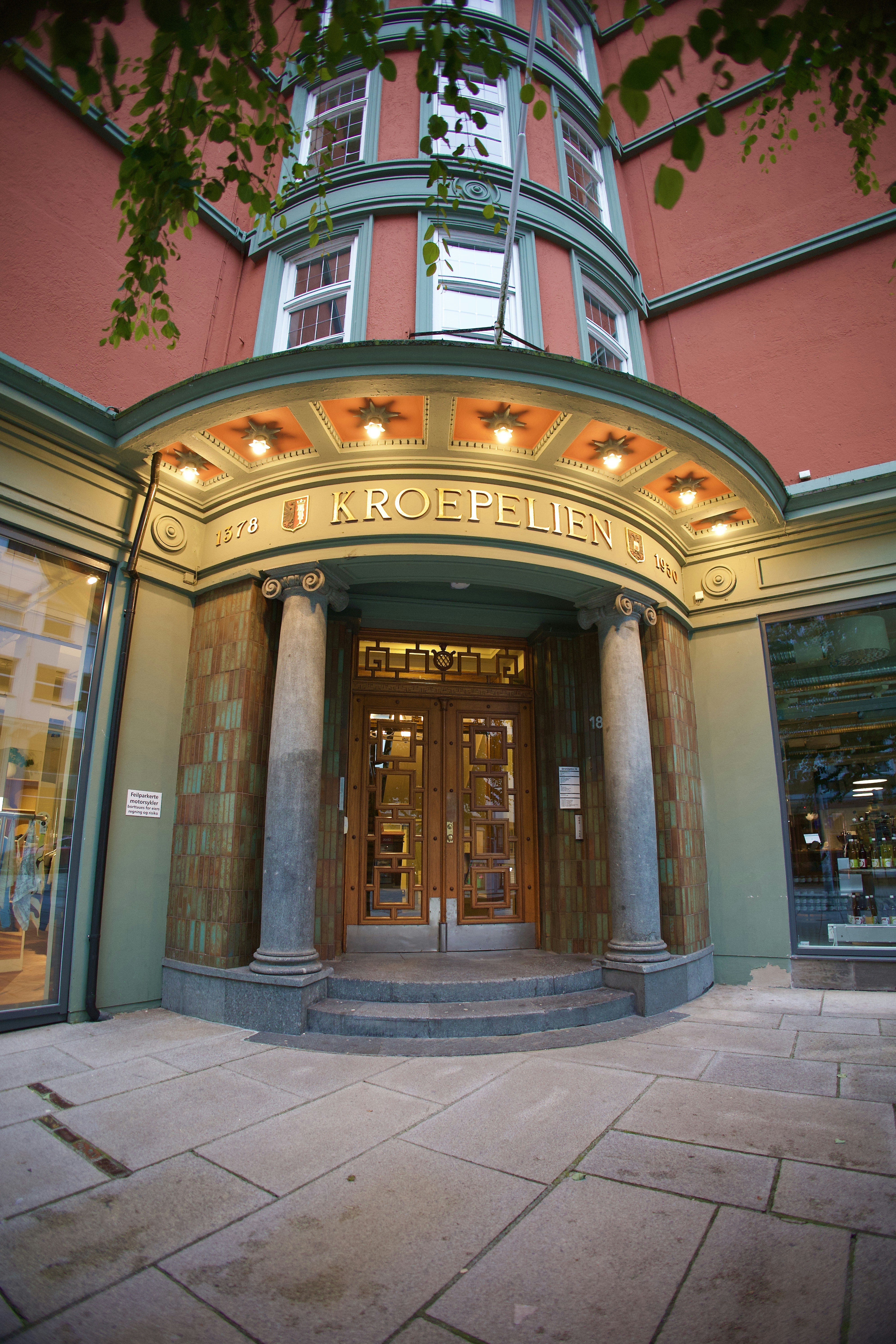 woman wearing yellow long-sleeved dress under white clouds and blue sky during daytime