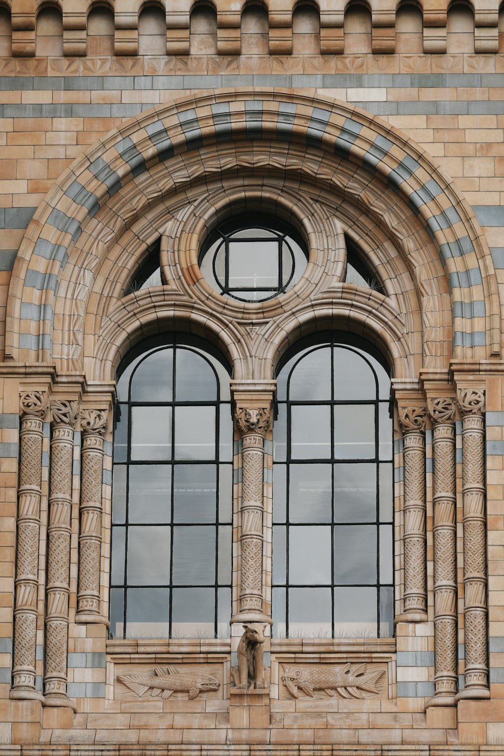 a large brick building with two arched windows