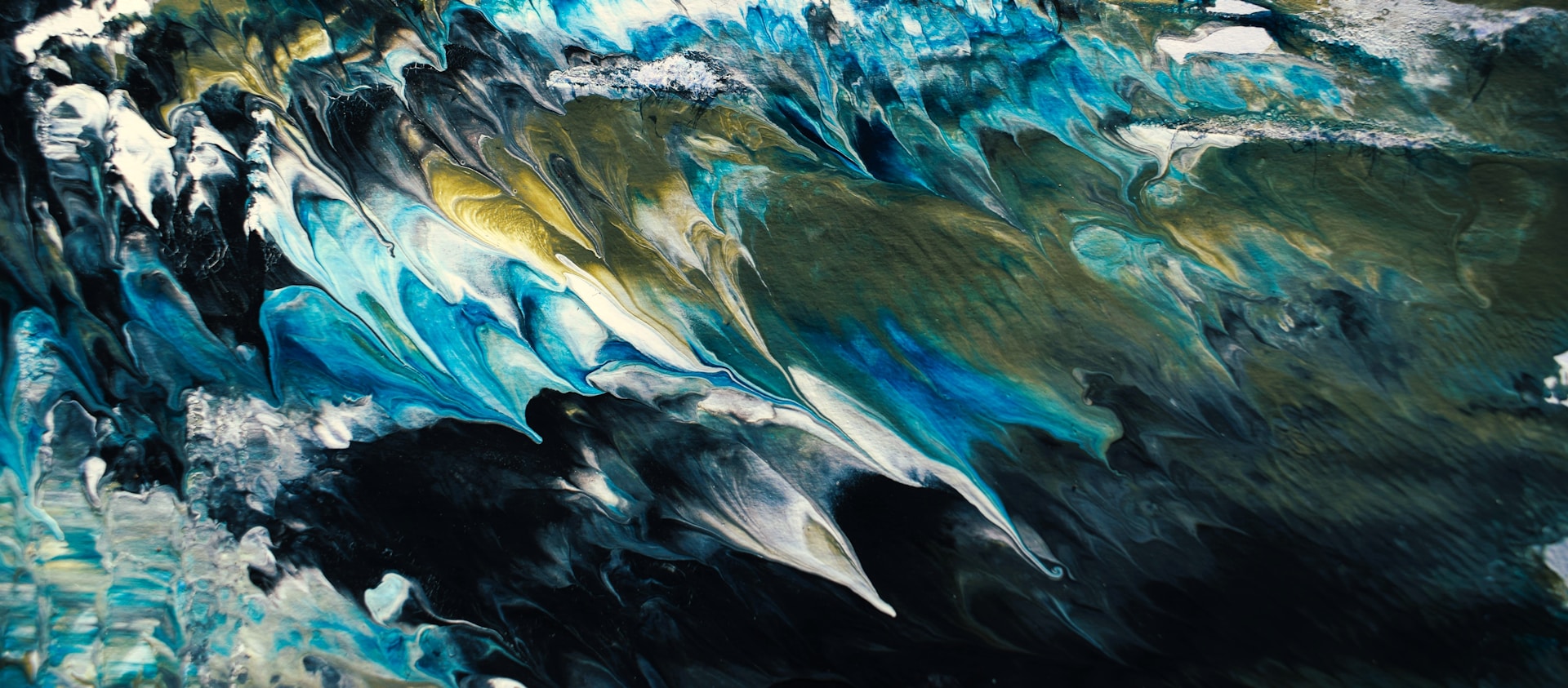 an abstract painting of blue and green waves