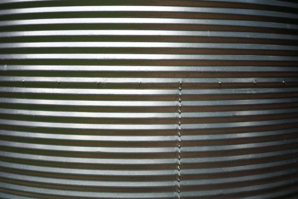 a close up of a metal object with lines on it