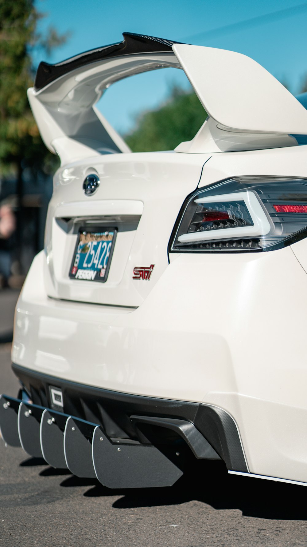 a white car parked on the side of the road