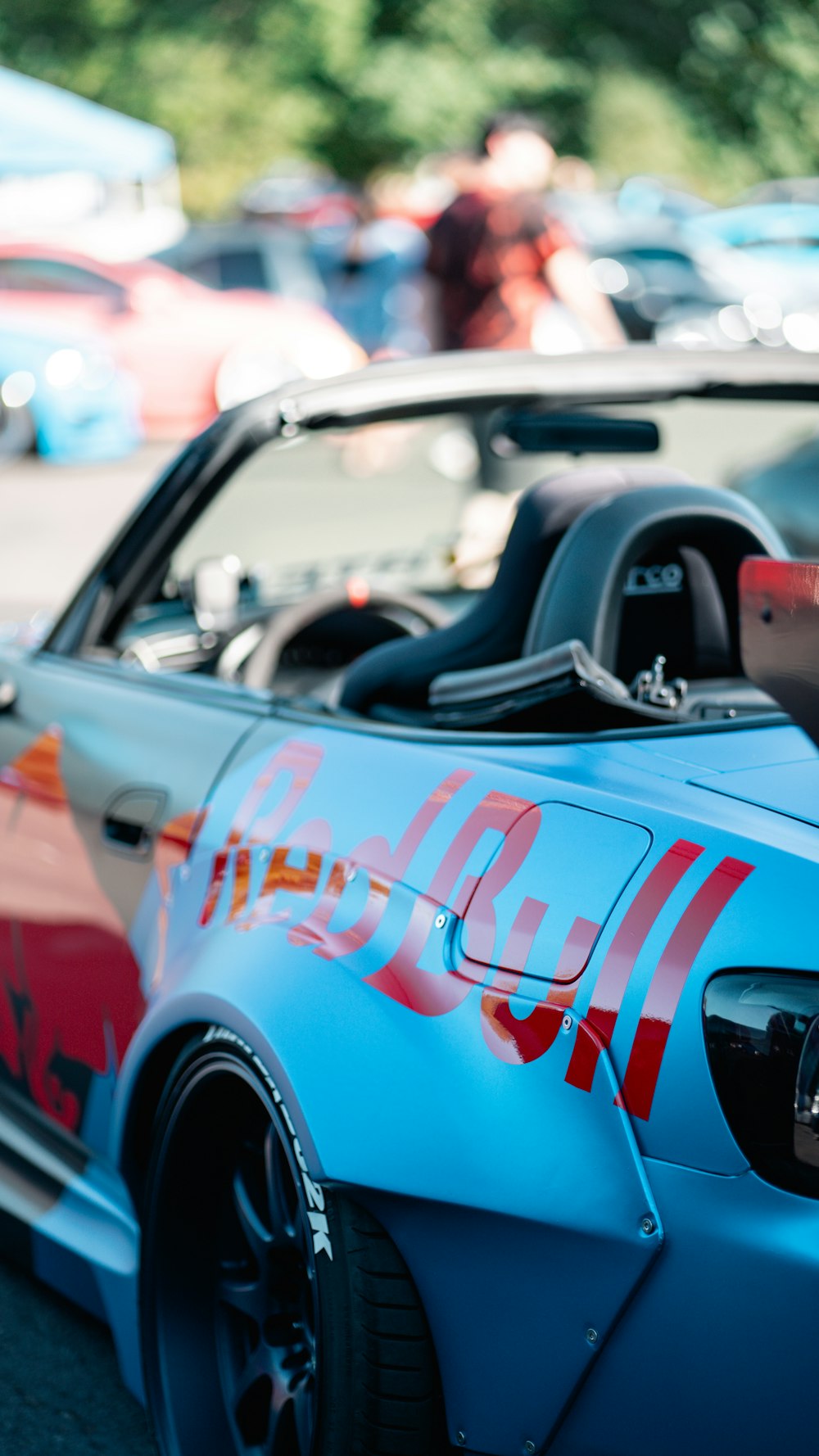 a blue car with a coca cola painted on it