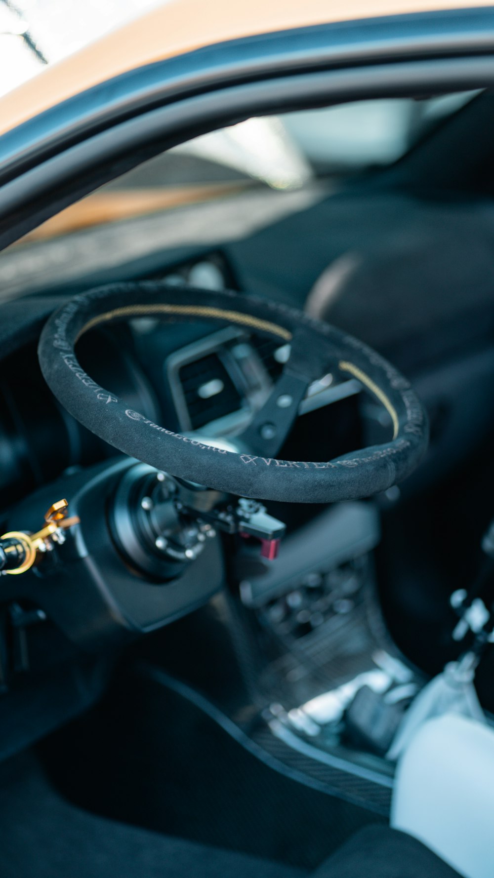 a close up of a steering wheel on a car