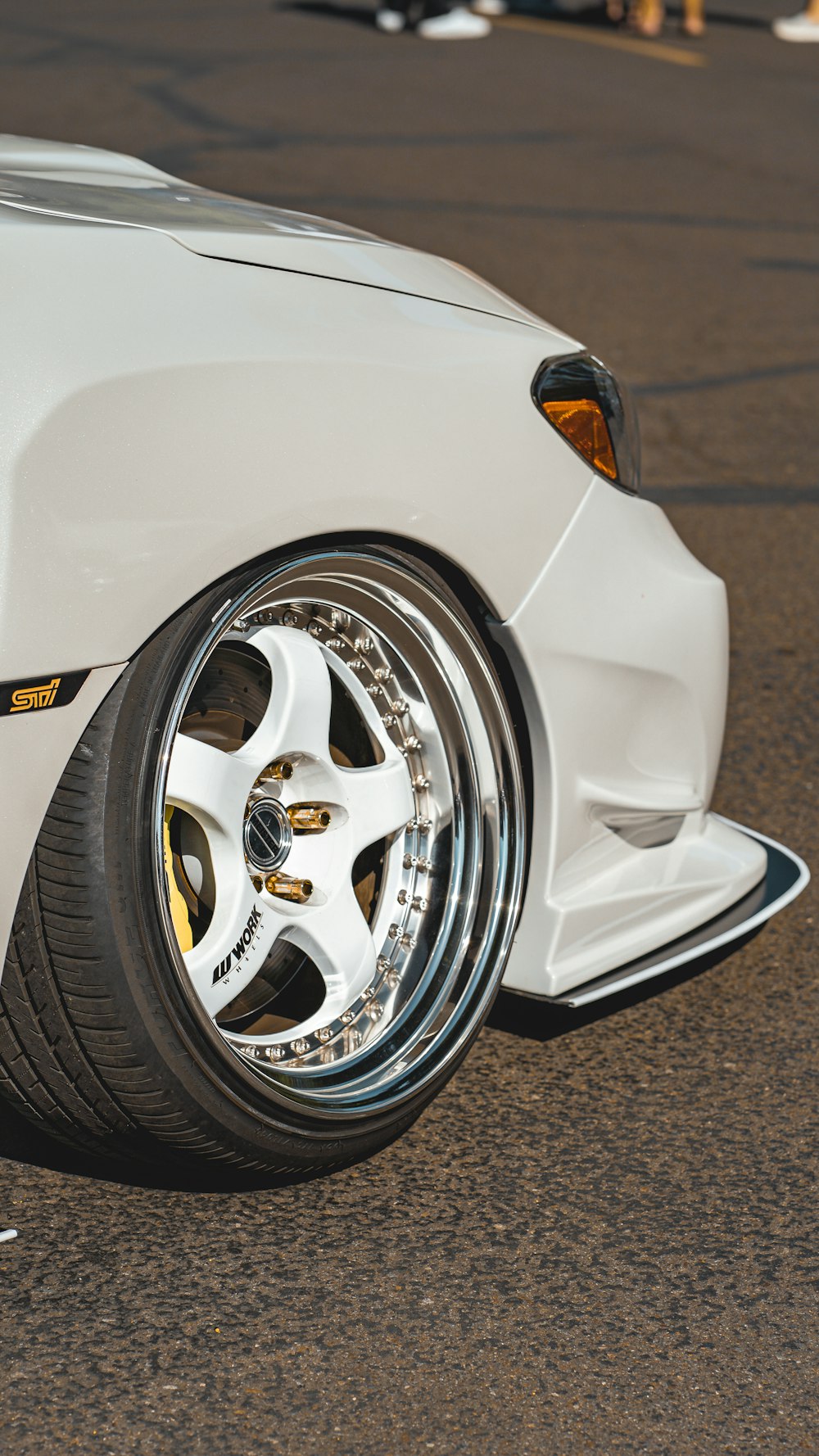 a white sports car parked on the street