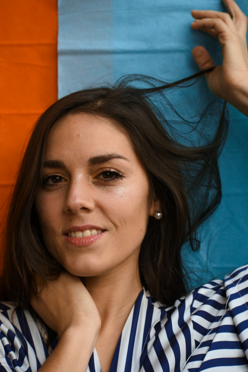 a woman with her hair blowing in the wind