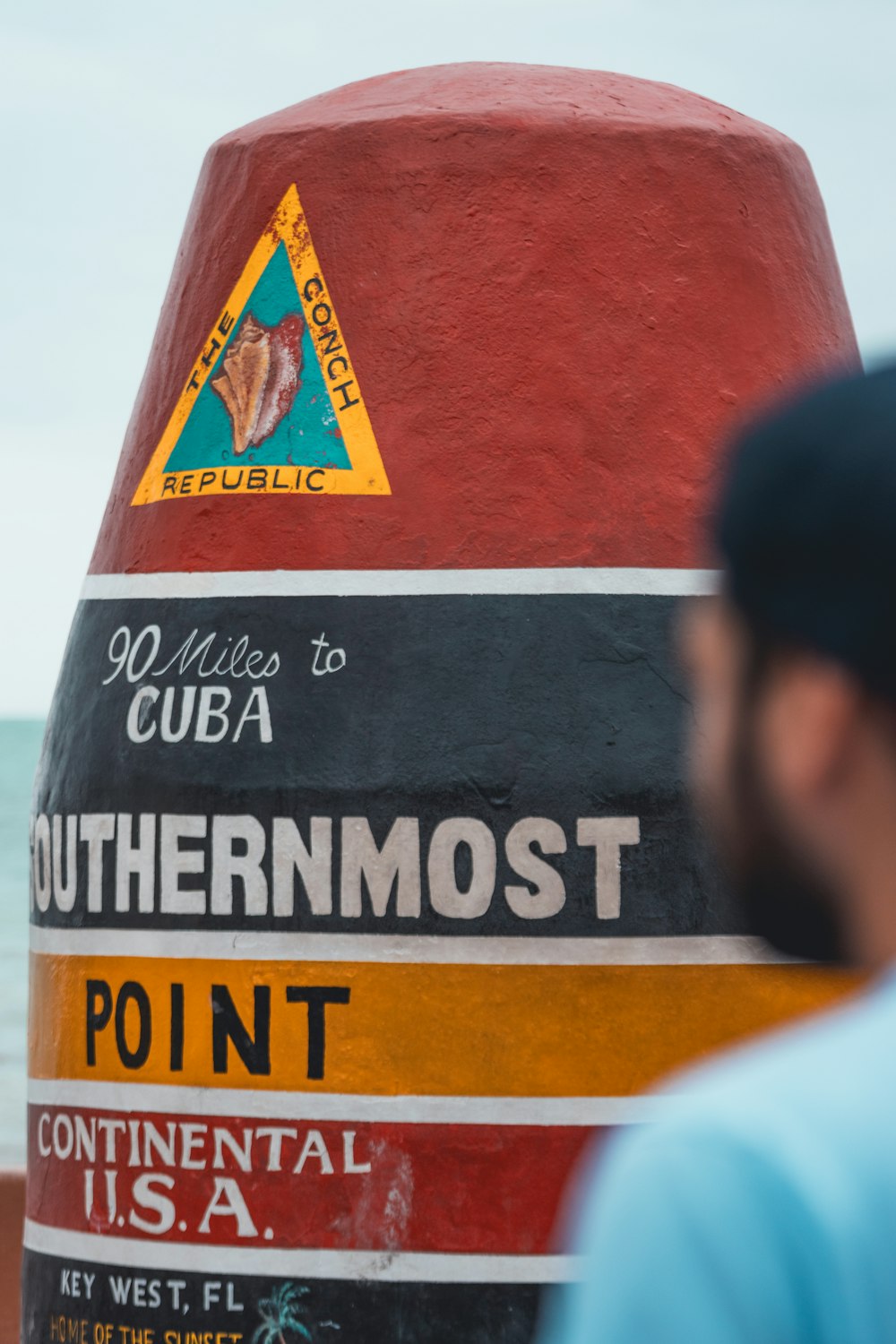 a close up of a pole with a sign on it