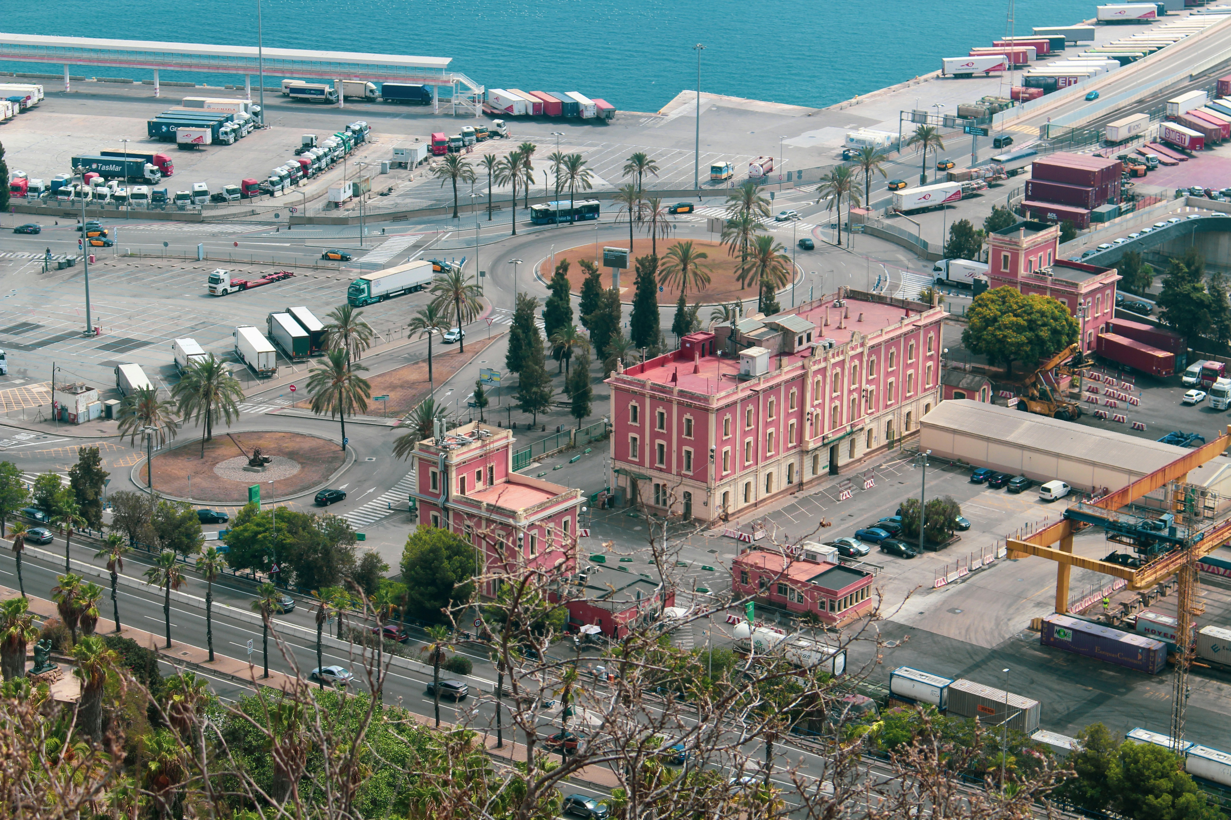 an aerial view of a large pink building, 