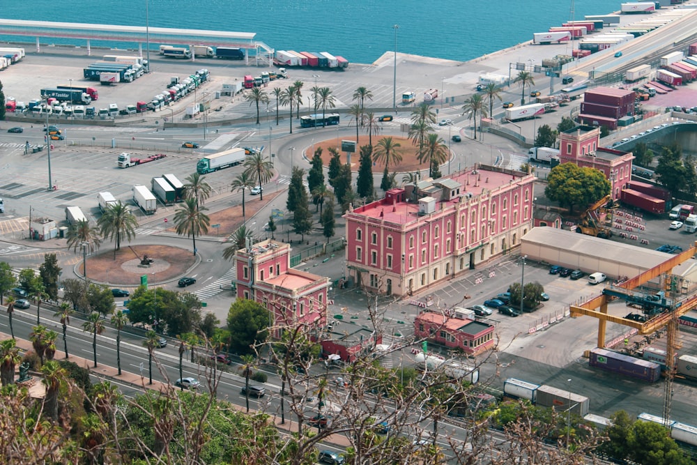 an aerial view of a large pink building