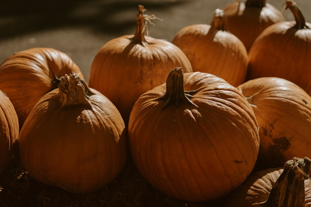 a pile of pumpkins sitting next to each other