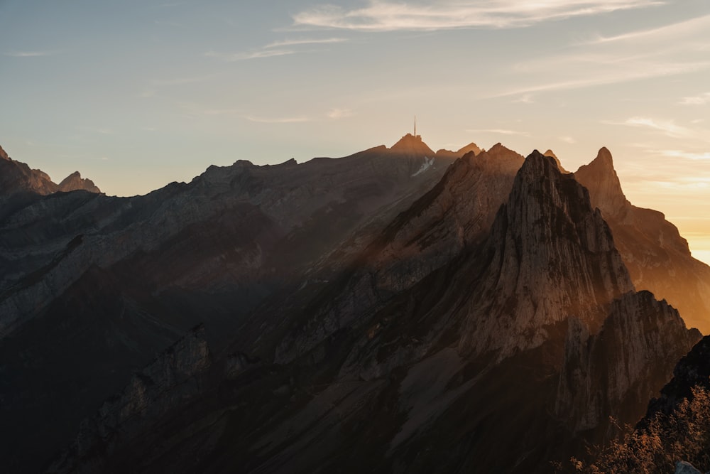 a view of a mountain range at sunset