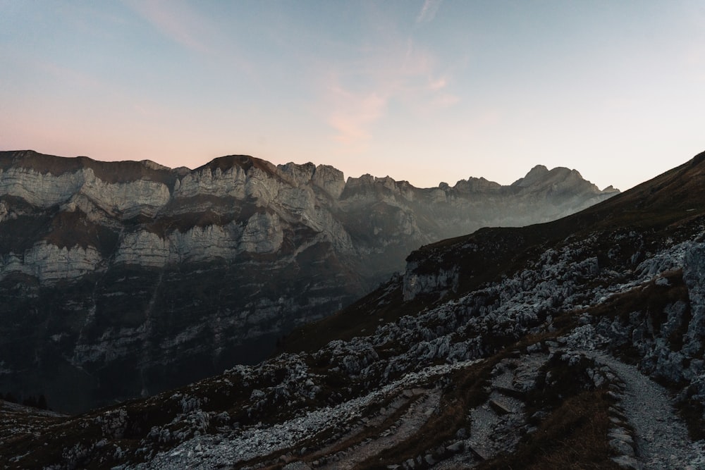 a view of a mountain range at sunset