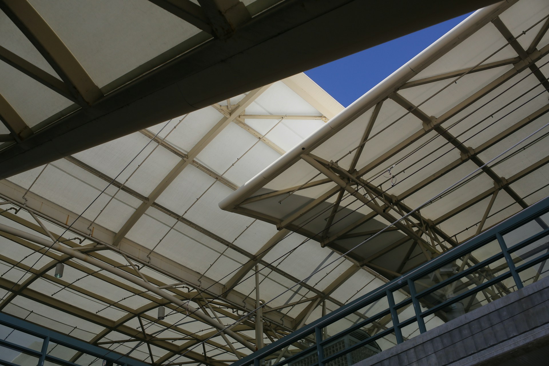 a large metal structure with a blue sky in the background
