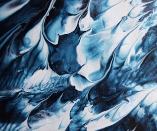 a close up of a blue and white painting