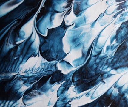 a close up of a blue and white painting