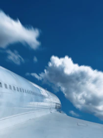 A private jet taking off into a clear blue sky, symbolizing freedom and swift travel.