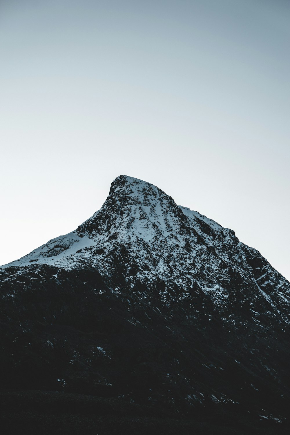 a snow covered mountain with a sky background