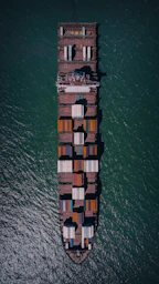a large cargo ship in the middle of the ocean