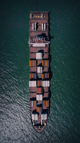 a large cargo ship in the middle of the ocean
