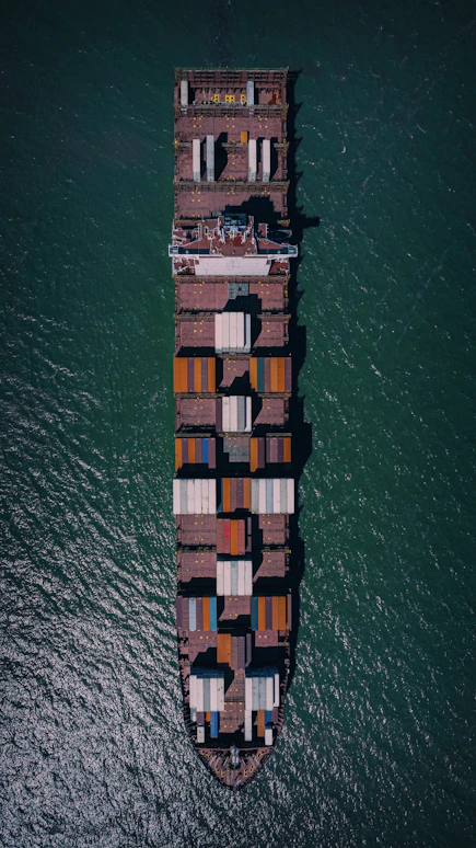 a large cargo ship in the middle of the ocean