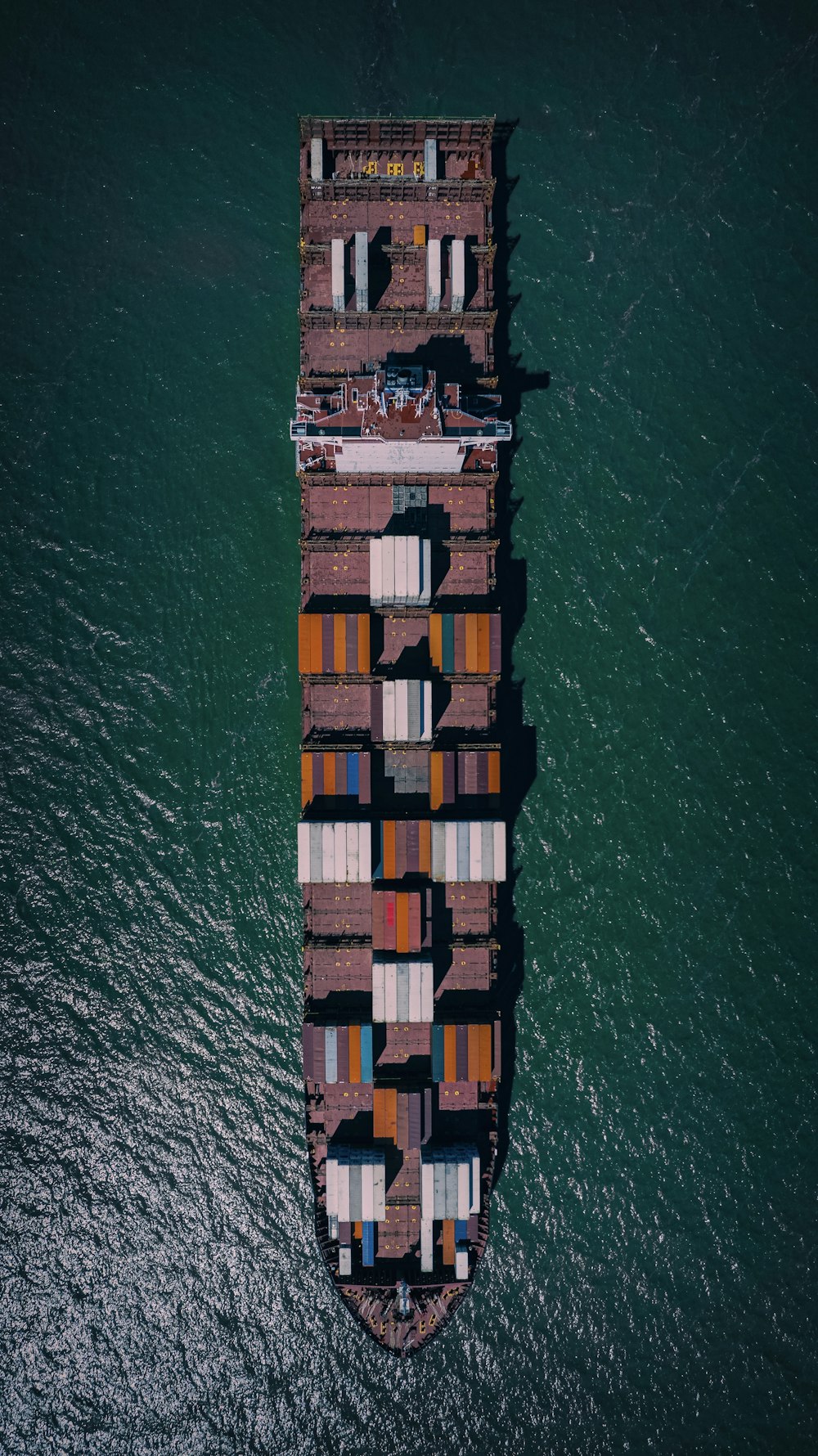 a large cargo ship in the middle of the ocean