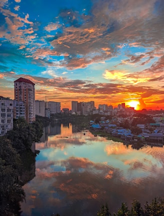 Sunset over the Pearl River with city lights of Guangzhou glowing warmly.