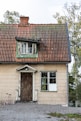 an old house with a bicycle parked in front of it