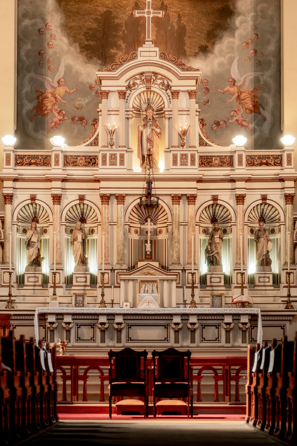 the interior of a church with a painting on the wall