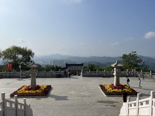 Charming courtyard with traditional lanterns and flowering plants.
