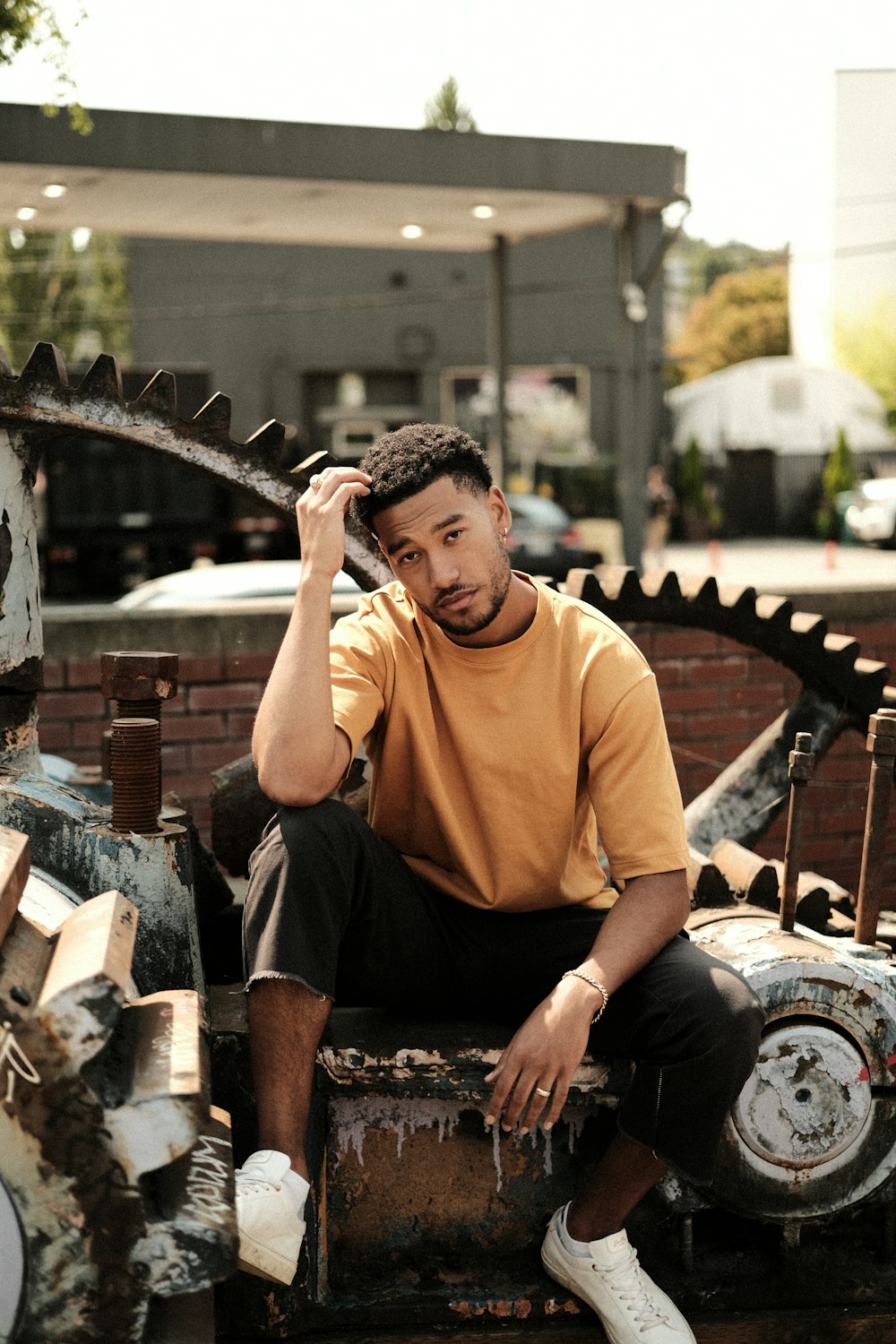 a man sitting on top of a rusty machine