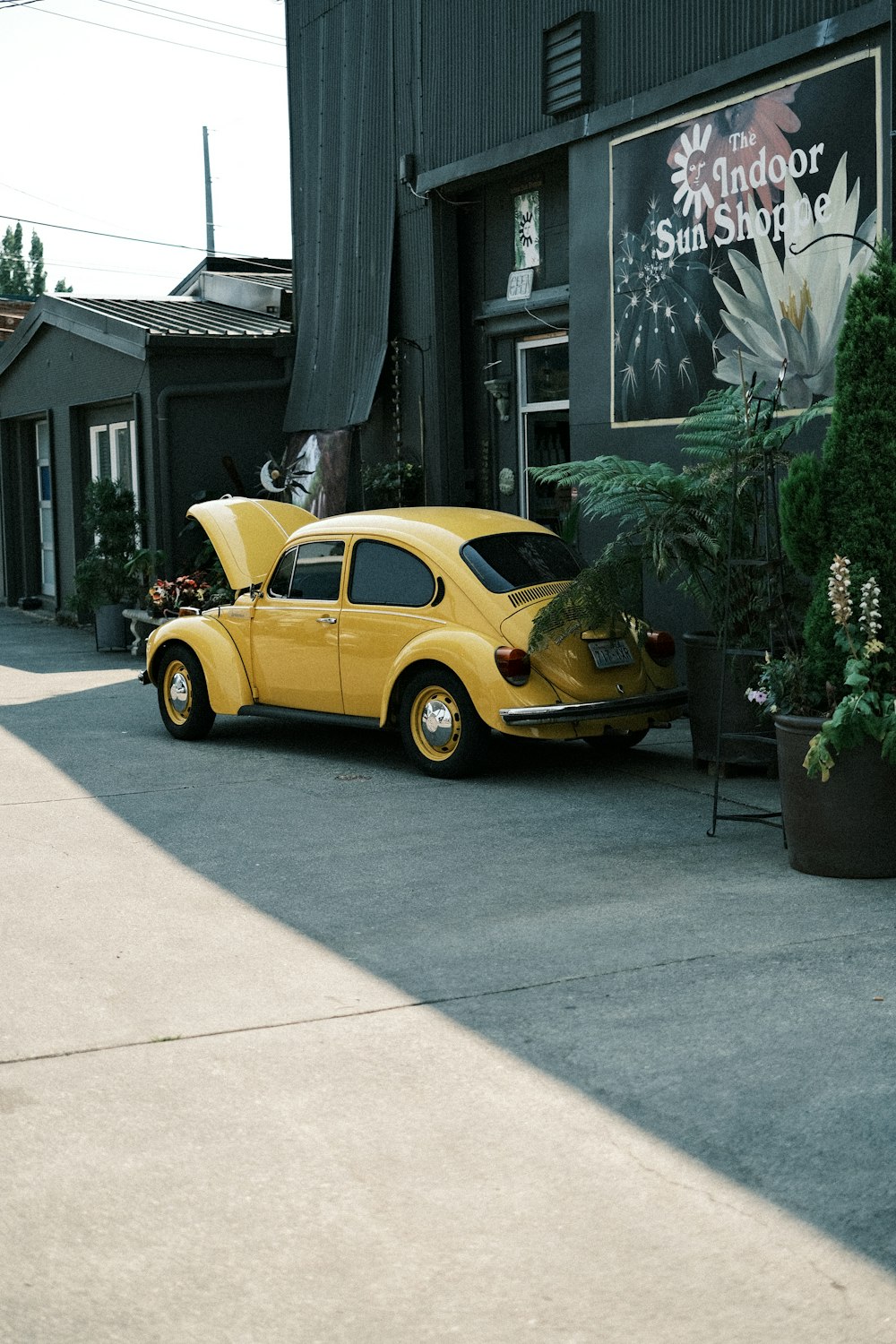 a yellow car parked in front of a building