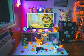 A cozy corner with shelves filled with Pokémon card binders and memorabilia.