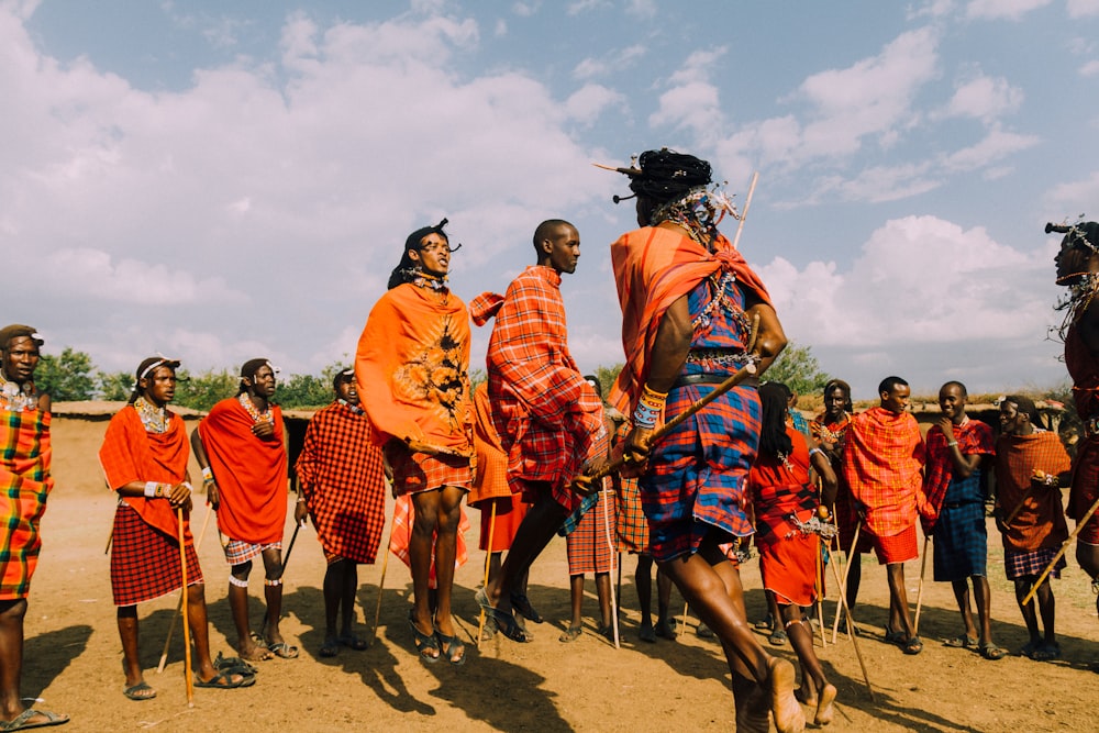 a group of people standing around each other