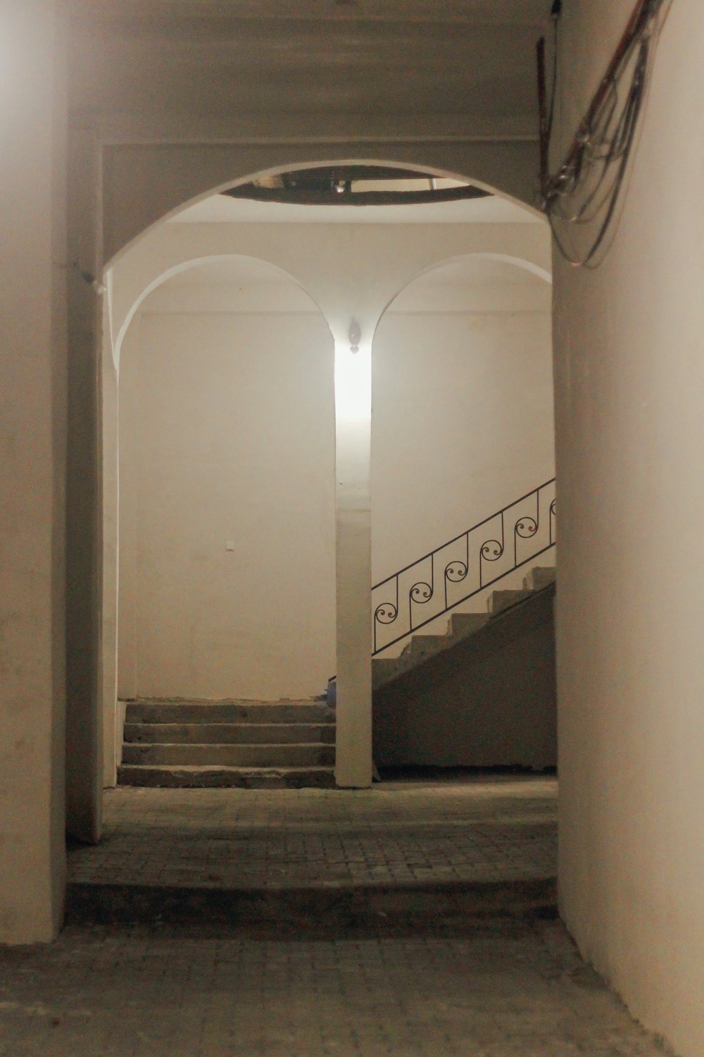 an empty hallway with a light on the ceiling