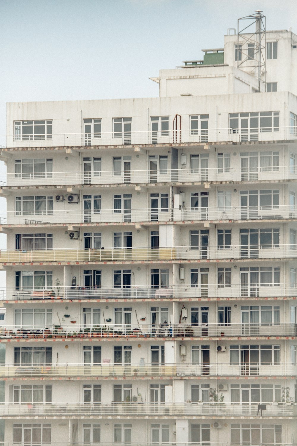 a very tall building with lots of windows and balconies